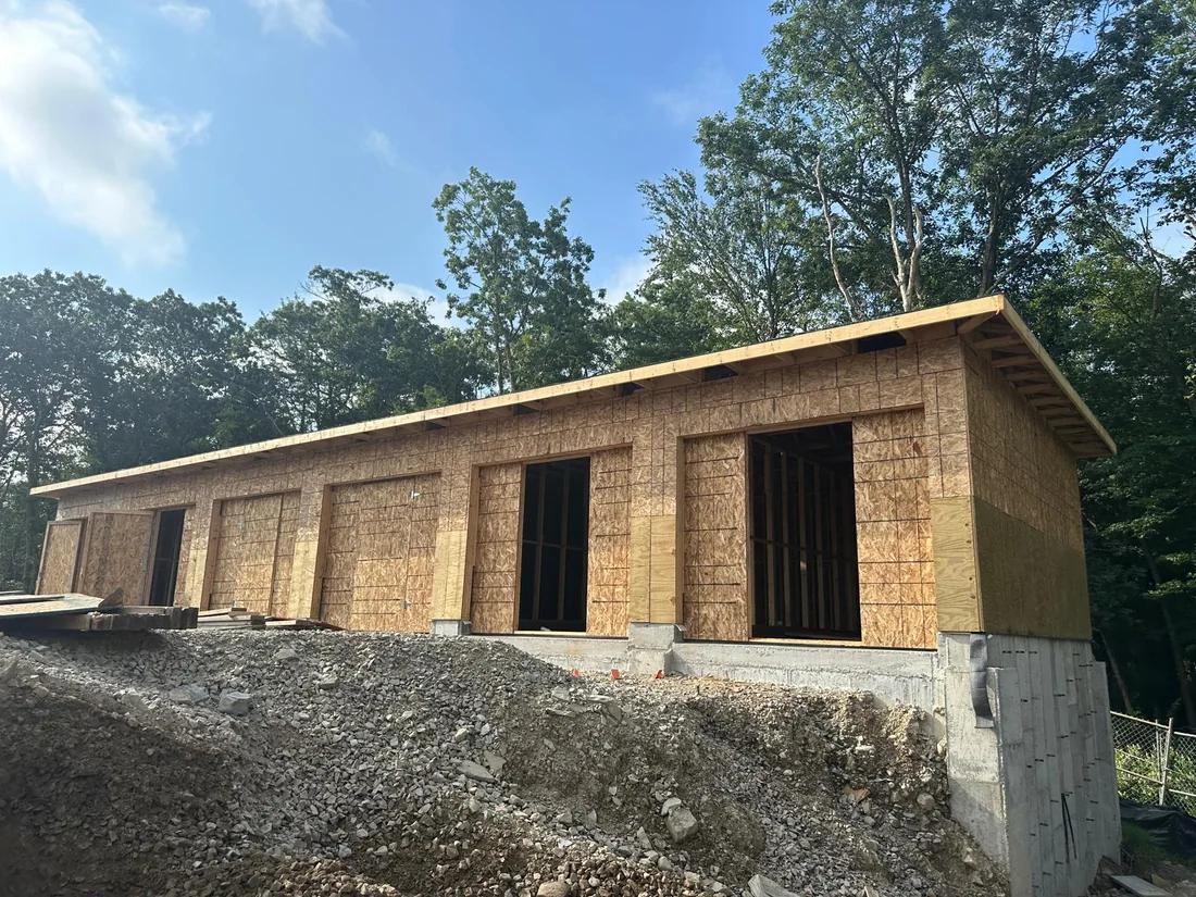 Wall and roof sheathing on a framed building, from the National Lumber project archive