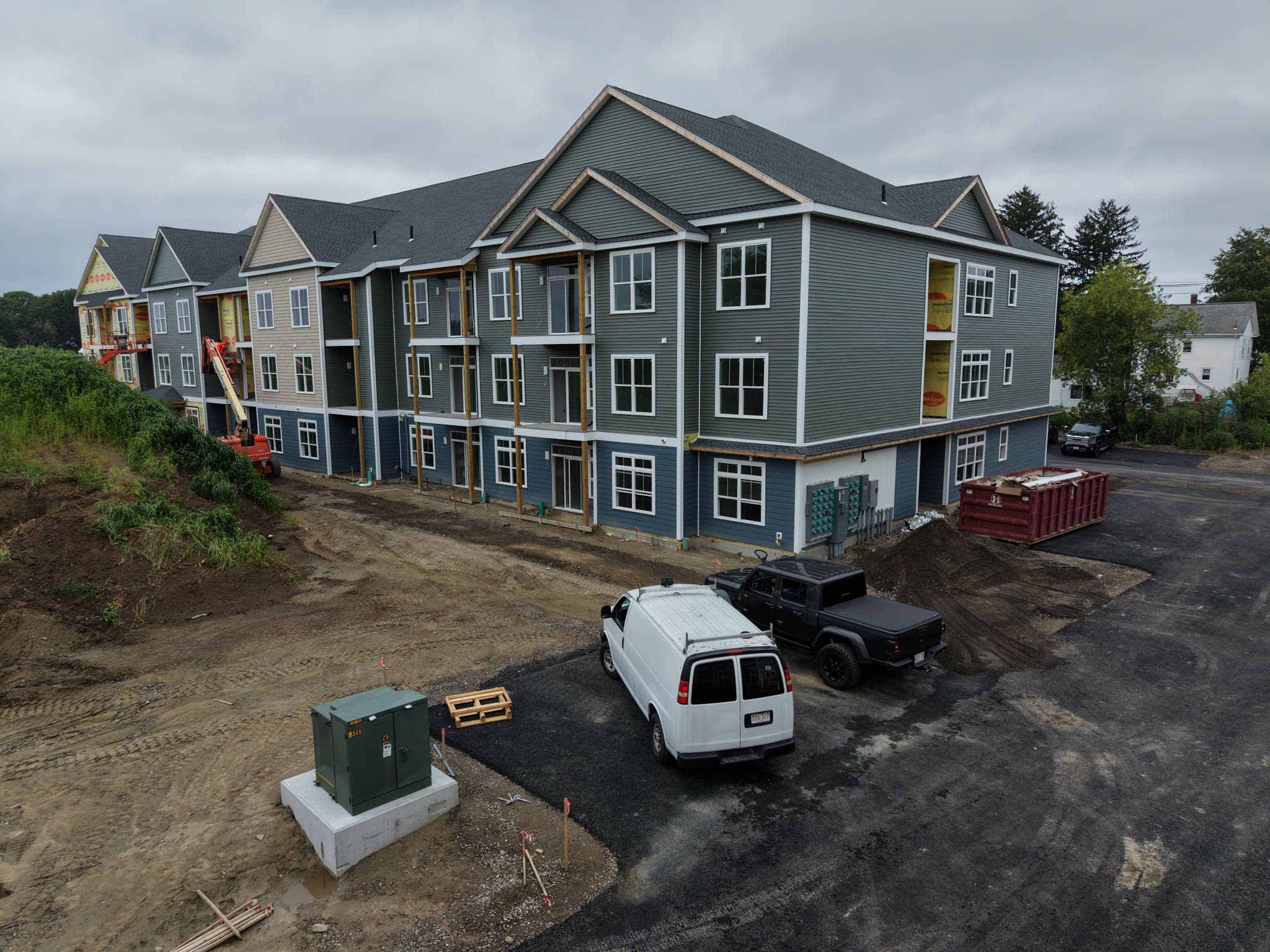 Aerial view of three-story multifamily buildings under construction